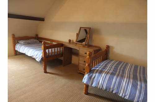 Spacious bedroom with 3 single beds on second floor
